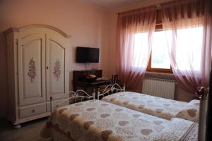 Postel nebo postele na pokoji v ubytování B&B Paola e Francesco