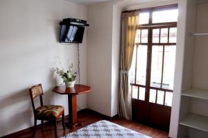 TV a/nebo společenská místnost v ubytování Rio Hotel