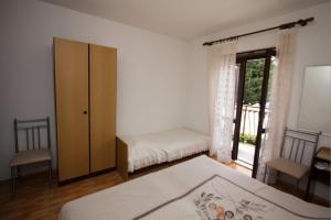 Ένα ή περισσότερα κρεβάτια σε δωμάτιο στο Guest House Nevena