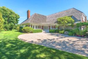 a large house with a pathway in front of it at Villa Victoria - Cozy Hamptons Villa in Bridgehampton