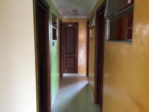 an empty hallway with a door in a house at Hostal VIYAJE in Funza