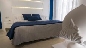 Tempat tidur dalam kamar di Hotel Scialara