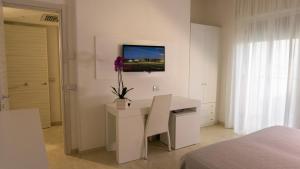 Tempat tidur dalam kamar di Hotel Scialara