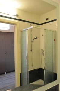 a shower in a room with a glass enclosure at Residence La Repubblica in Florence