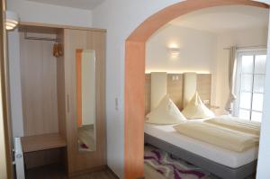 Tempat tidur dalam kamar di Hotel Mezzero