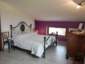 Voodi või voodid majutusasutuse B&B Books & Bikes toas