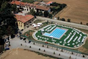 an overhead view of a swimming pool with white flowers at Villa Scati Bed and Breakfast in Melazzo