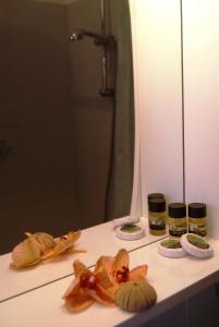 a bathroom counter with some food on it at Fofi Apartments in Symi