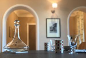 a table with a glass bottle on top of a table at Boulevard Jules Ferry in Brive-la-Gaillarde