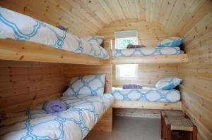 A bed or beds in a room at Coach Field Camp