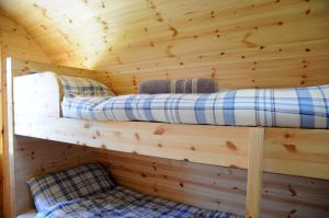 A bed or beds in a room at Coach Field Camp