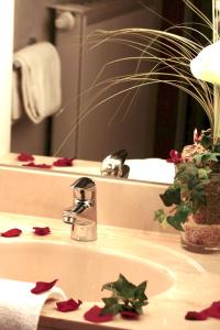 a bathroom sink with christmas star decorations on it at Ara Classic in Ingolstadt