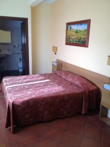 Postel nebo postele na pokoji v ubytování Hotel Tempio di Apollo