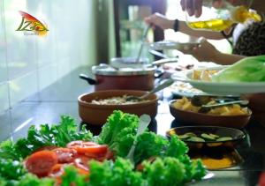 a buffet with a bunch of food on a table at Pousada Recanto Iza in Alfredo Chaves