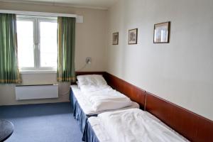 Ein Bett oder Betten in einem Zimmer der Unterkunft Moi Hotel