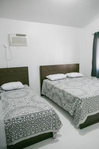 Ένα ή περισσότερα κρεβάτια σε δωμάτιο στο DS2 - 2 Dorm PIscina AR WIFI Churrasqueira - BRUNO KLEMTZ +39 φωτογραφίες