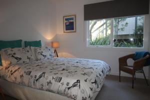 Un pat sau paturi într-o cameră la Seaview Lorne