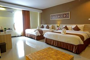 Katil atau katil-katil dalam bilik di Red Chilies Hotel