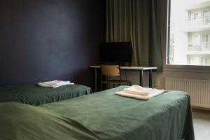 Postel nebo postele na pokoji v ubytování Vuokatti Sport Resort