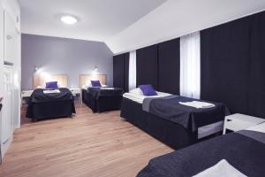 Postel nebo postele na pokoji v ubytování Vuokatti Sport Resort