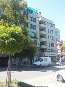 a white van parked in front of a building at Central Studio Maritsa in Plovdiv