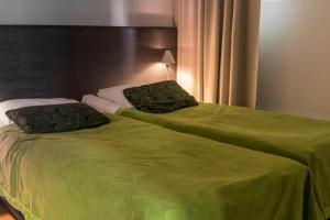 Кровать или кровати в номере Vuokatti Sport Chalets +37 фотографий