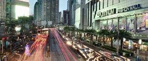 a busy city street at night with cars at PR Place Hotel in Bangkok