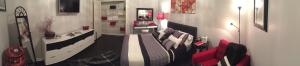 a living room with a couch and a table at Premier National Harbor House in Fort Washington