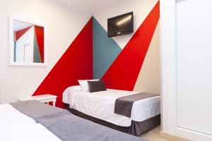 Postel nebo postele na pokoji v ubytování Hotel Carlos V