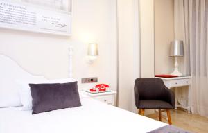 Postel nebo postele na pokoji v ubytování Hotel Carlos V