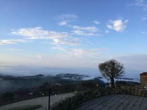 a view from a balcony overlooking a city at La Dispensa-bio agriturismo in Lamporecchio