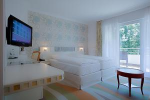 Postel nebo postele na pokoji v ubytování Ringhotel Strandblick + 26 fotografií