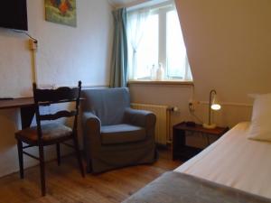 Postel nebo postele na pokoji v ubytování Hotel de Vriezerbrug