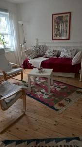 a living room with a couch and a coffee table at Haus Toni in Bad Füssing