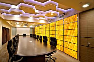 a conference room with a long table and chairs at The Seacare Hotel in Singapore