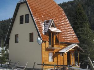 a small house with an orange roof on top of it at Apartment Vila Fila in Mitrovac