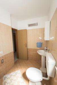a bathroom with a toilet and a sink at Apartment Ana in Pula