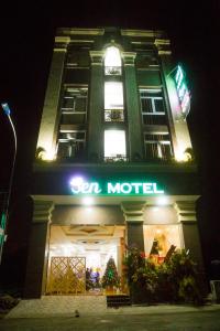 a building with a sign for a hotel at night at Sen Motel in Bien Hoa