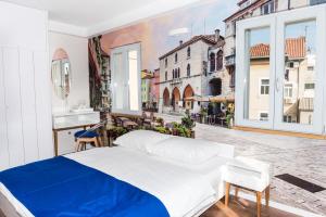 a bedroom with a bed and a view of a city at Villa Galla in Split