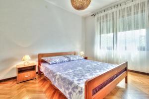 Postel nebo postele na pokoji v ubytování LOVRIĆ house with apartments