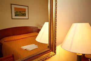 Postel nebo postele na pokoji v ubytování Hotel Rittinger