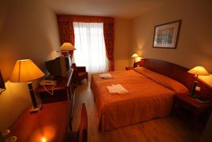 Postel nebo postele na pokoji v ubytování Hotel Rittinger