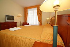 Postel nebo postele na pokoji v ubytování Hotel Rittinger
