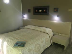 A bed or beds in a room at La Locanda di Piazza