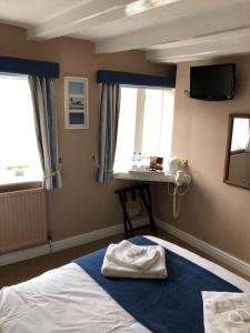 A bed or beds in a room at Bramblewick 