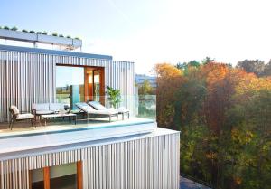a balcony of a house with a view of trees at Hotel Arima & Spa - Small Luxury Hotels in Donostia-San Sebastián