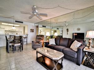 a living room with a couch and a table at 440 West Condo 1604N in Clearwater Beach