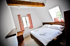 Кровать или кровати в номере Resort U Fořta