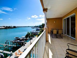 a balcony with a view of the water and boats at Island Key Condos 302 in Clearwater Beach