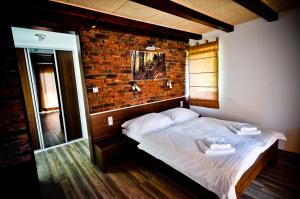 Кровать или кровати в номере Resort U Fořta